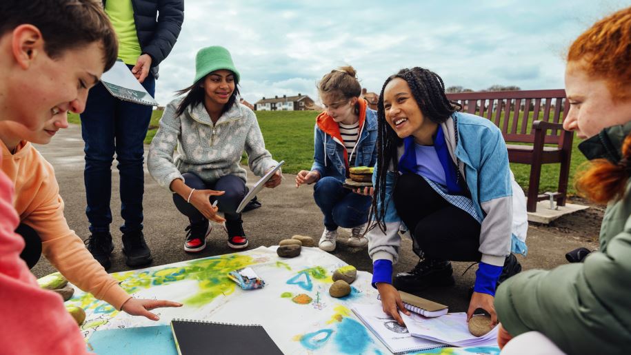 Children outside working on an art project